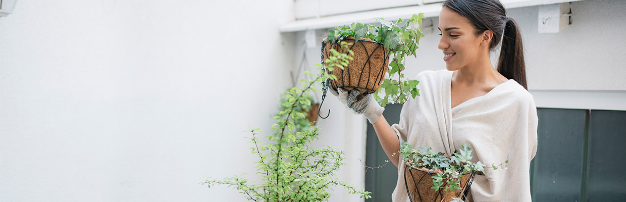 Woman smiles at plants